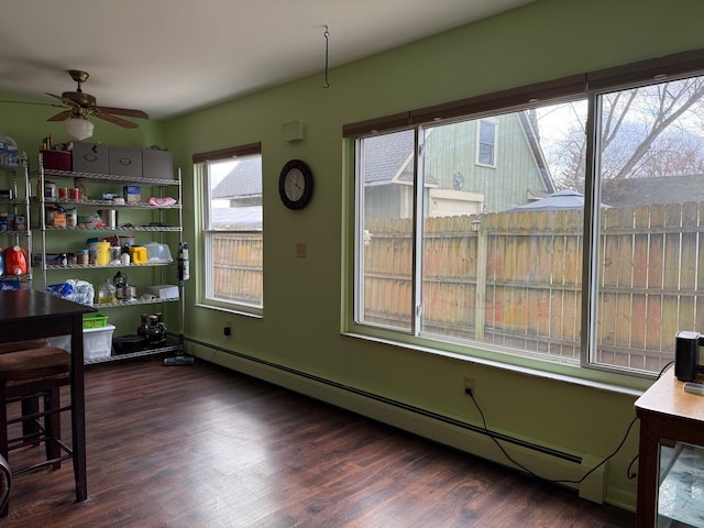 317 Clark St Unit B, Clinton, MI 49236 - dining space with wood finished floors, a ceiling fan, and a baseboard radiator