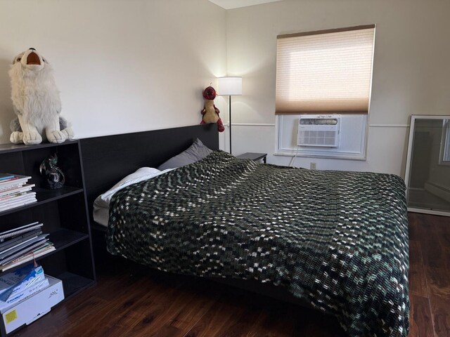 317 Clark St Unit B, Clinton, MI 49236 - bedroom with cooling unit and wood finished floors