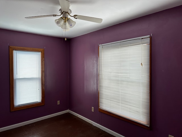 4469 Cooper Rd, Marlette, MI 48453 - empty room featuring a ceiling fan, dark wood-type flooring, and baseboards