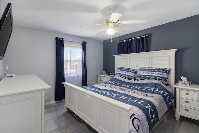 bedroom featuring ceiling fan and dark wood finished floors
