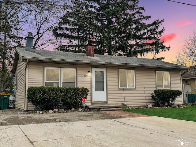 view of front of home featuring a chimney