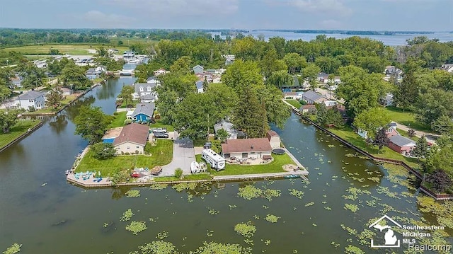 birds eye view of property with a residential view and a water view