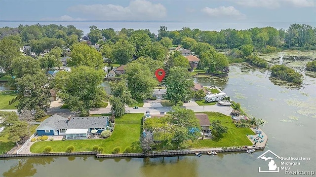 birds eye view of property featuring a water view