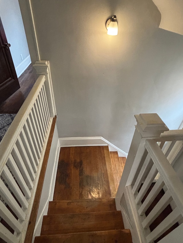 4074 Pasadena St, Detroit, MI 48238 - staircase featuring baseboards and wood finished floors
