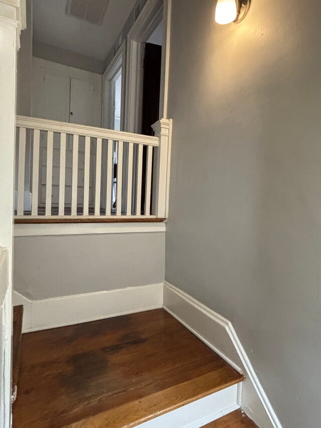 4074 Pasadena St, Detroit, MI 48238 - stairs with baseboards, visible vents, and wood finished floors