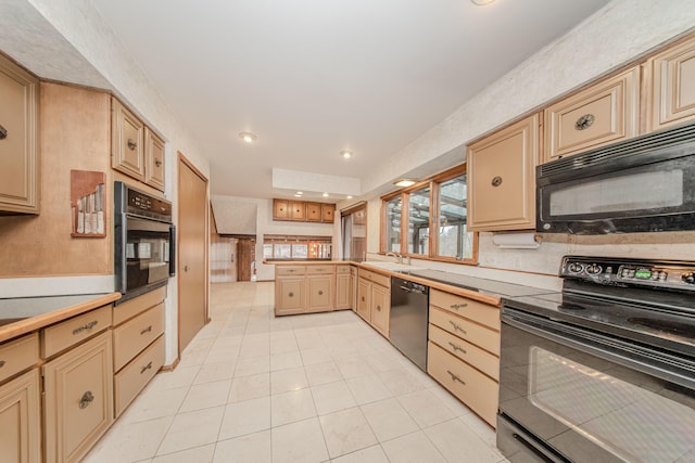 4710 Cove Rd, West Bloomfield, MI 48323 - kitchen with black appliances, a sink, light tile patterned floors, cream cabinets, and recessed lighting