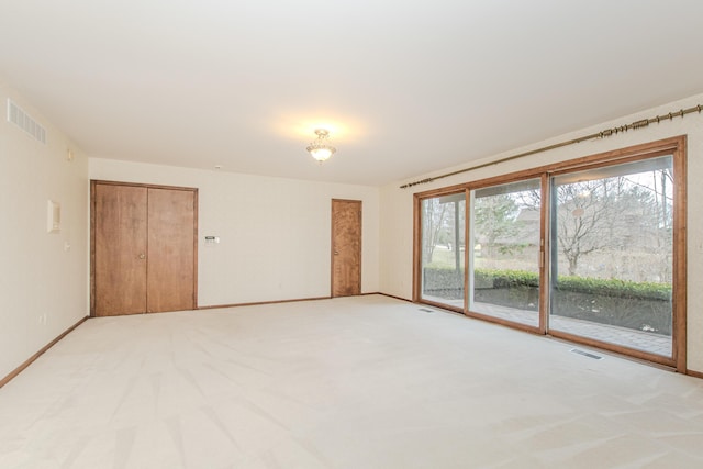 4710 Cove Rd, West Bloomfield, MI 48323 - spare room with light carpet and baseboards