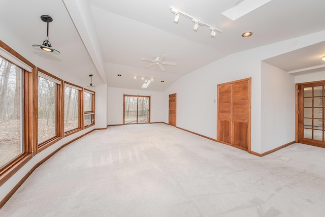 4710 Cove Rd, West Bloomfield, MI 48323 - spare room with a skylight, lofted ceiling, baseboards, and light carpet