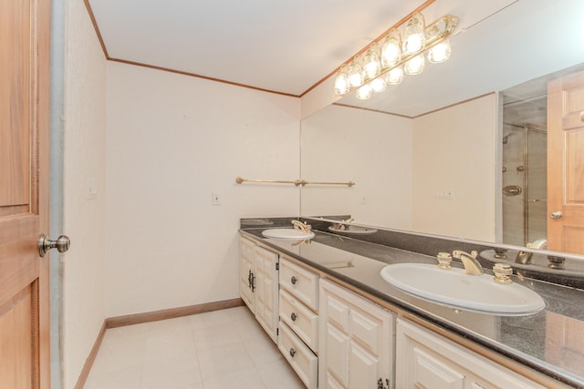 4710 Cove Rd, West Bloomfield, MI 48323 - bathroom with double vanity, baseboards, an enclosed shower, crown molding, and tile patterned flooring