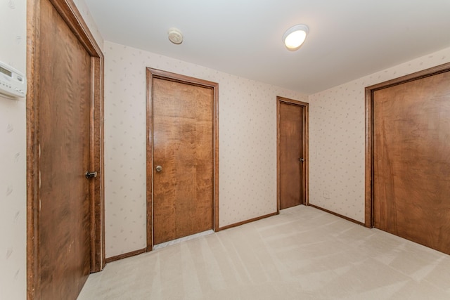 4710 Cove Rd, West Bloomfield, MI 48323 - unfurnished bedroom with light carpet and wallpapered walls