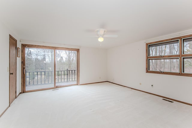 4710 Cove Rd, West Bloomfield, MI 48323 - unfurnished room featuring light carpet, ceiling fan, healthy amount of natural light, and baseboards