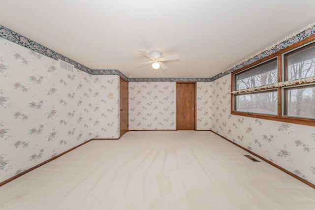 4710 Cove Rd, West Bloomfield, MI 48323 - spare room featuring a ceiling fan, wallpapered walls, and light colored carpet