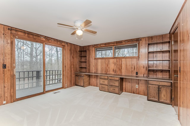 4710 Cove Rd, West Bloomfield, MI 48323 - unfurnished office with wooden walls, built in study area, a ceiling fan, built in features, and plenty of natural light