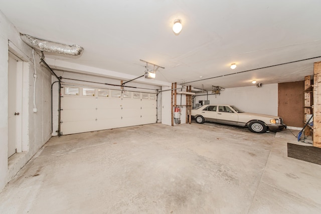 4710 Cove Rd, West Bloomfield, MI 48323 - garage featuring a garage door opener