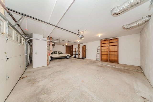 4710 Cove Rd, West Bloomfield, MI 48323 - garage featuring a garage door opener