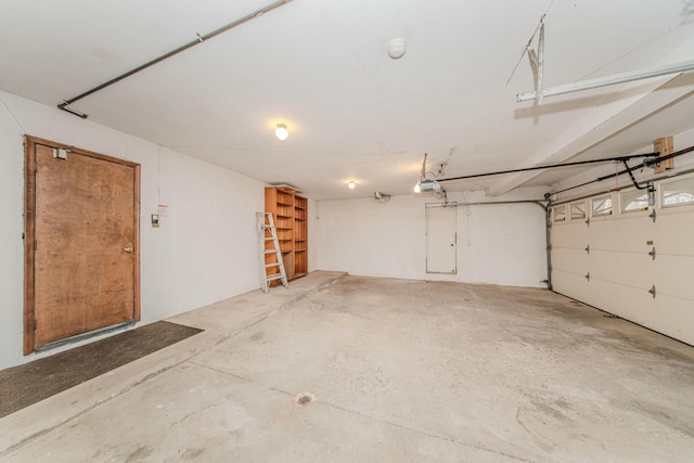 4710 Cove Rd, West Bloomfield, MI 48323 - garage featuring a garage door opener