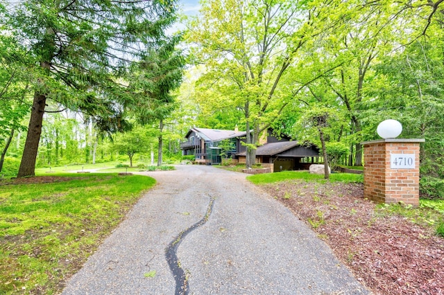 4710 Cove Rd, West Bloomfield, MI 48323 - obstructed view of property with asphalt driveway
