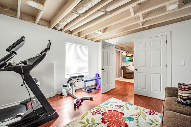 exercise room with wood finished floors