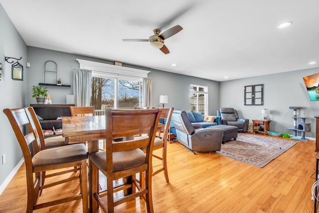 dining room with recessed lighting, light wood finished floors, baseboards, and a ceiling fan