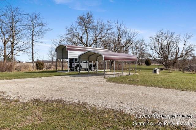 view of parking with driveway and a detached carport
