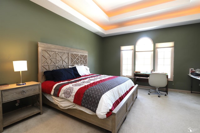 7241 Hidden Valley Dr, Lambertville, MI 48144 - bedroom featuring carpet floors, a tray ceiling, and baseboards