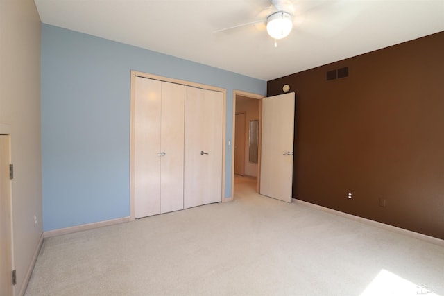 7241 Hidden Valley Dr, Lambertville, MI 48144 - unfurnished bedroom with a closet, visible vents, baseboards, ceiling fan, and carpet floors