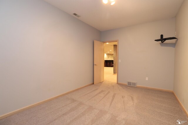 7241 Hidden Valley Dr, Lambertville, MI 48144 - spare room with baseboards, visible vents, and light colored carpet