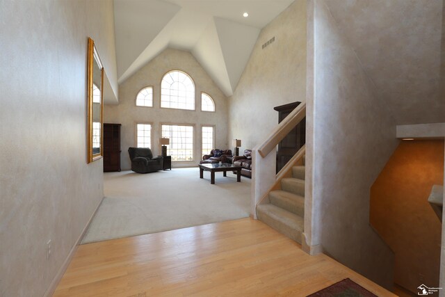 7241 Hidden Valley Dr, Lambertville, MI 48144 - stairway with high vaulted ceiling, visible vents, and wood finished floors