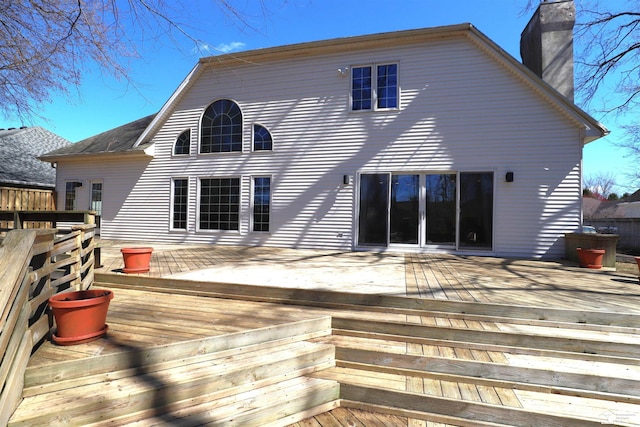 7241 Hidden Valley Dr, Lambertville, MI 48144 - back of house with a chimney and a deck