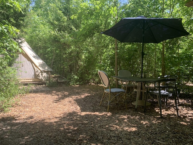 view of yard with a wooded view