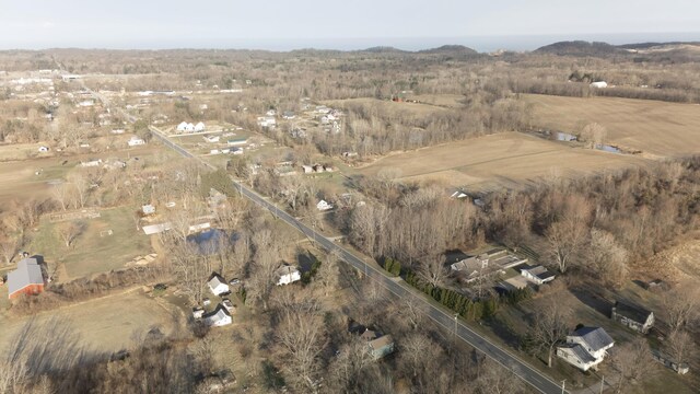 birds eye view of property with a rural view