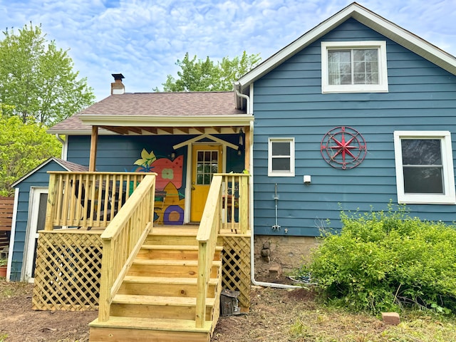5366 Sawyer Rd, Sawyer, MI 49125 - view of front of property featuring a chimney, a shingled roof, and stairs