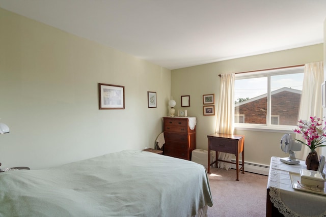 bedroom with light carpet and a baseboard heating unit