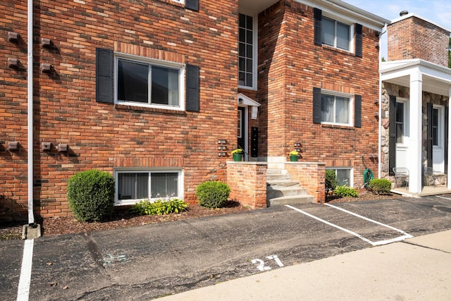 view of property with uncovered parking
