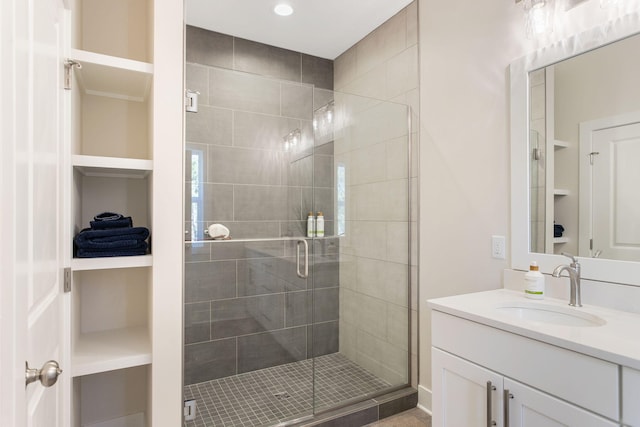 full bath featuring vanity and a stall shower