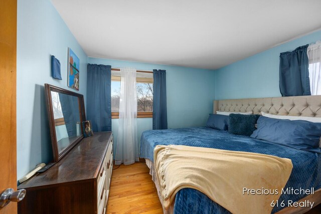 bedroom with light wood-type flooring