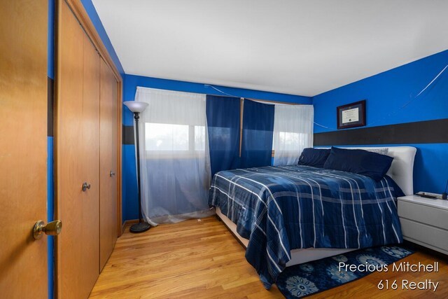bedroom featuring a closet and wood finished floors