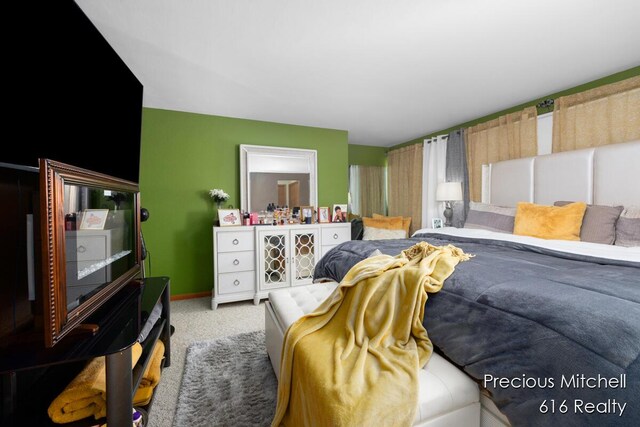 carpeted bedroom with baseboards