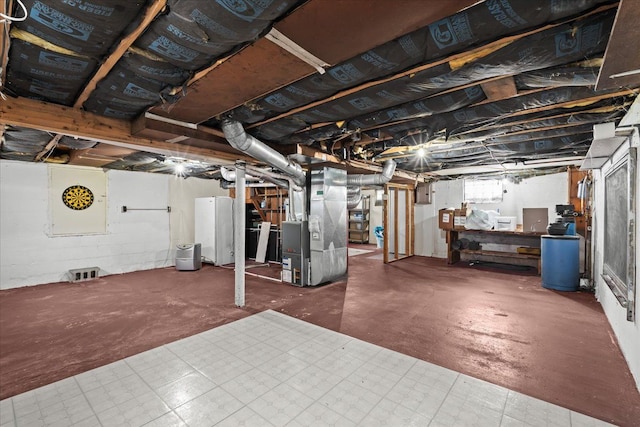 basement featuring heating unit