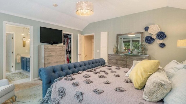 carpeted bedroom with ensuite bath, vaulted ceiling, a spacious closet, and a closet