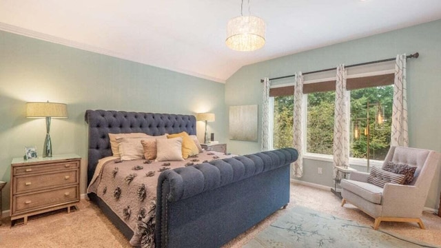 bedroom featuring baseboards, lofted ceiling, and light colored carpet