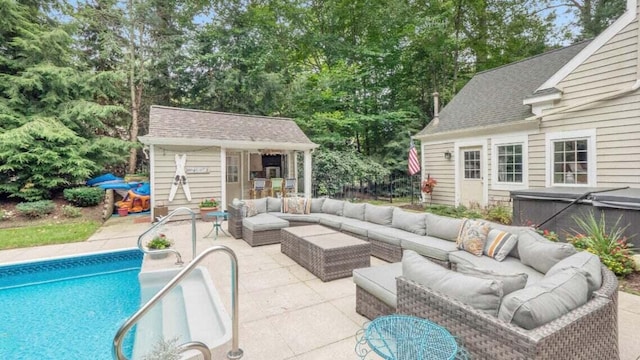 view of patio / terrace with an outdoor pool, a hot tub, an exterior structure, an outdoor structure, and an outdoor hangout area