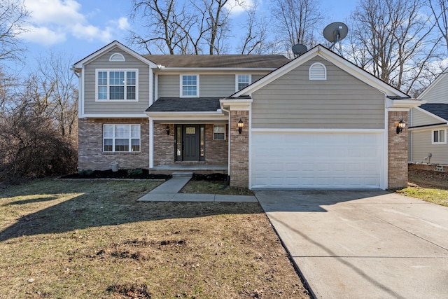 traditional home with a front lawn, driveway, an attached garage, and brick siding