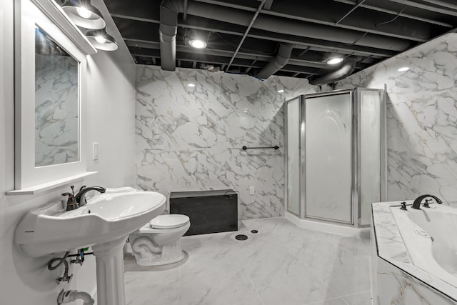 full bathroom with a stall shower, toilet, stone wall, a bath, and marble finish floor