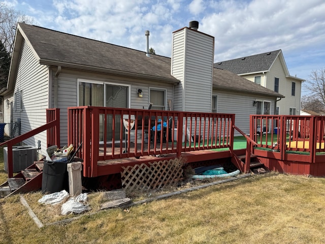 25966 Peppertree Ln, Warren, MI 48091 - rear view of house with cooling unit, a wooden deck, a shingled roof, a yard, and a chimney