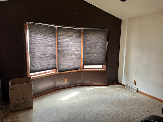 25966 Peppertree Ln, Warren, MI 48091 - carpeted spare room with baseboards, lofted ceiling, and visible vents