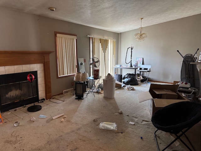25966 Peppertree Ln, Warren, MI 48091 - living area with carpet flooring, a textured ceiling, and a tiled fireplace