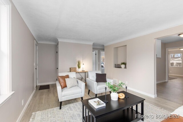 2100 Dawson Ave NE, Grand Rapids, MI 49505 - living room with baseboards and light wood-type flooring
