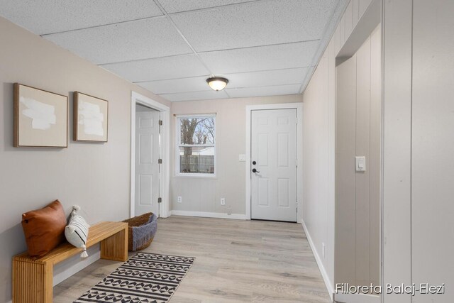 2100 Dawson Ave NE, Grand Rapids, MI 49505 - foyer with baseboards, light wood-style floors, and a paneled ceiling