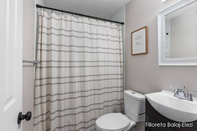 2100 Dawson Ave NE, Grand Rapids, MI 49505 - bathroom featuring a shower with shower curtain, toilet, and vanity